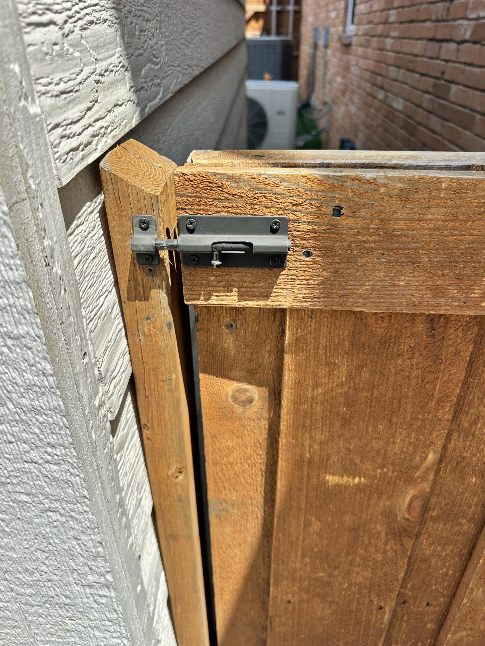 Wood gate rebuilt with latch hardware in Dallas